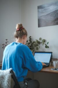 Small business owner reviewing accounting software dashboard on laptop
