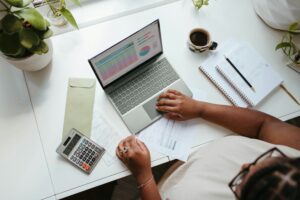 Business owner reviewing weekly cash flow and expenses