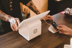 Customer making a payment at a small business POS system