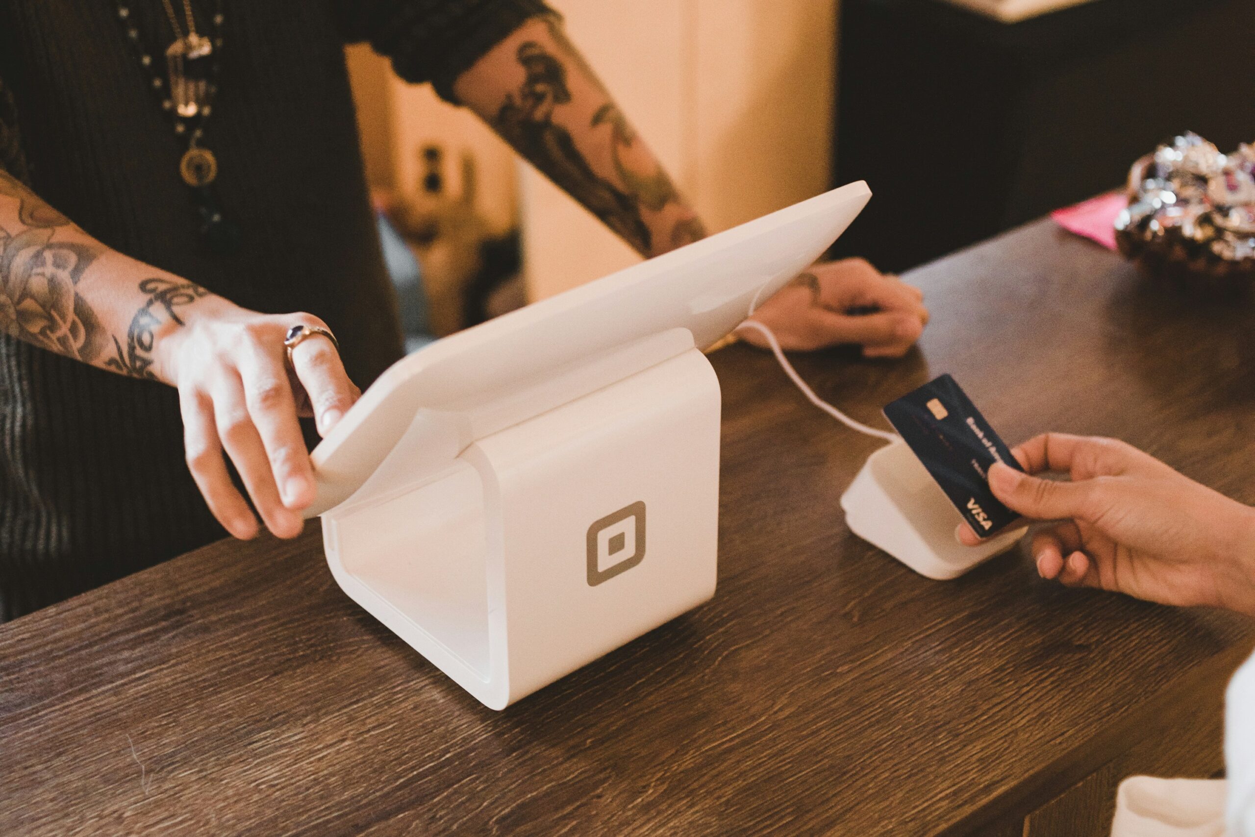Customer making a payment at a small business POS system